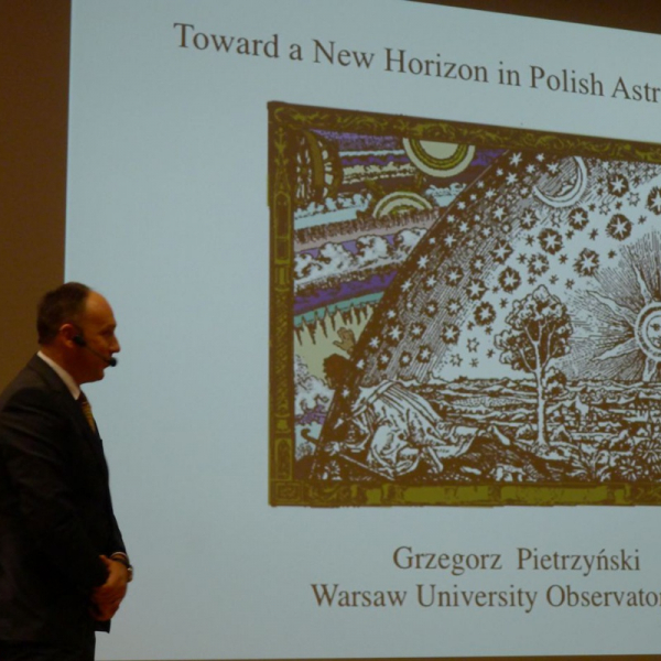 Grzegorz Pietrzyński giving a talk, 2013