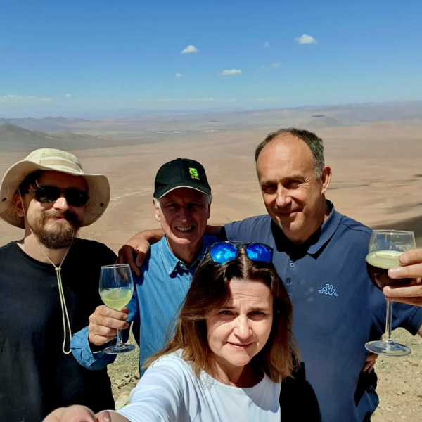 Bartek, Wolfgang, Ksenia and Grzesiek at the Observatory Cerro Armazones, currently Observatory Cerro Murphy (OCM), during construction of 3 new telescopes. The Atacama Desert in the background. March 2023