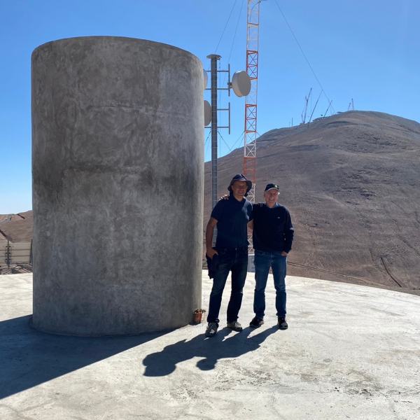 Grzesiek and Wolfgang next to the pillar of the future 2.5-m telescope "Wolfgang Gieren", at Observatory Cerro Armazones, currently Observatory Cerro Murphy, (OCM). The ELT construction in the background. March 2023.